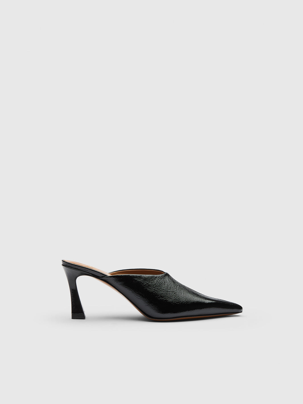 A single black pointed-toe mule heel with a textured leather finish, shown in profile against a light gray background.