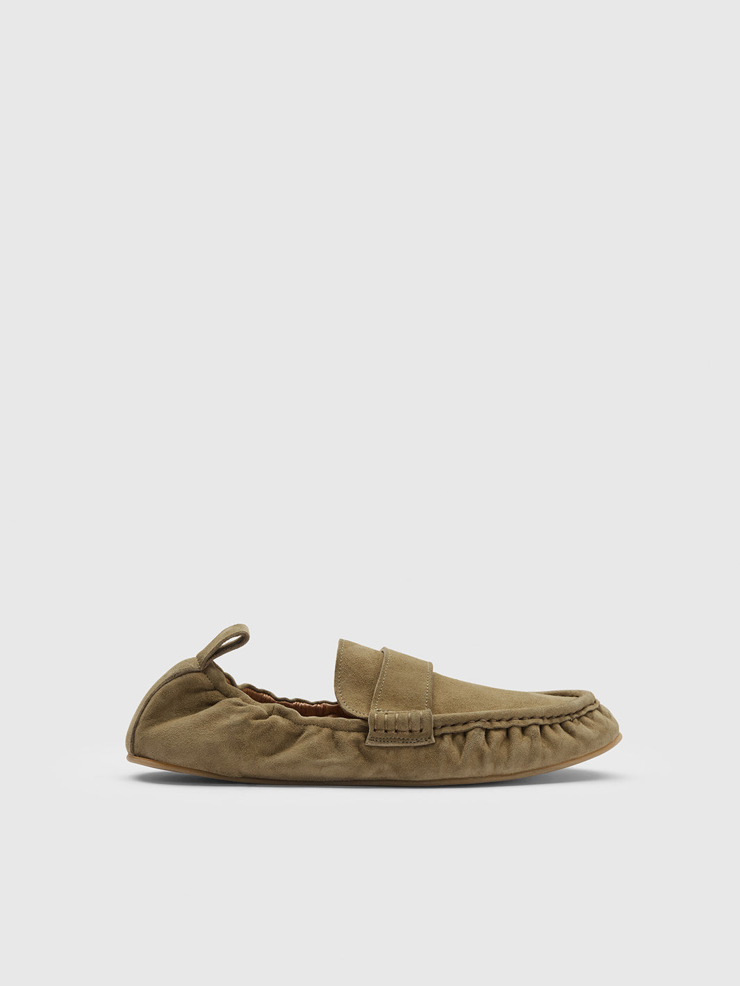 A single tan suede moccasin loafer with a rop heel shown in profile against a light gray background.